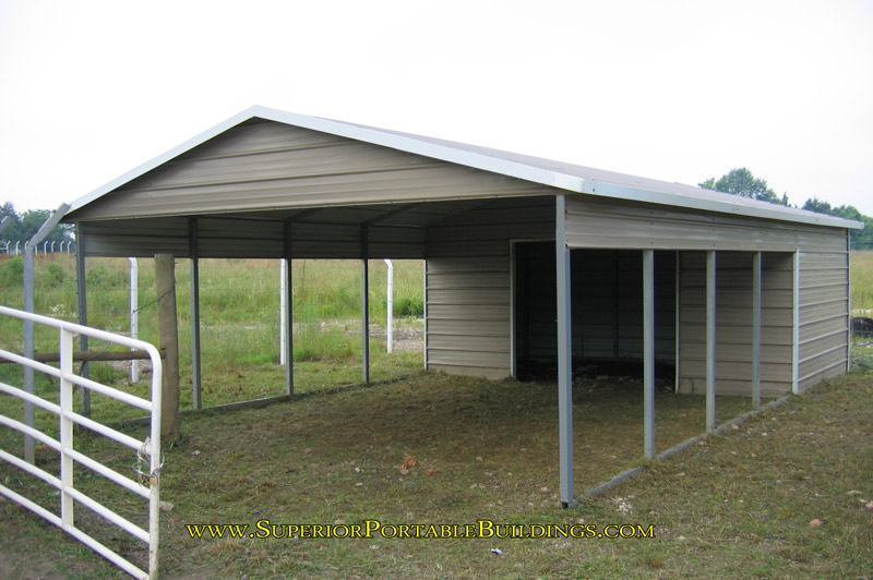 Carport with storage building on rear.