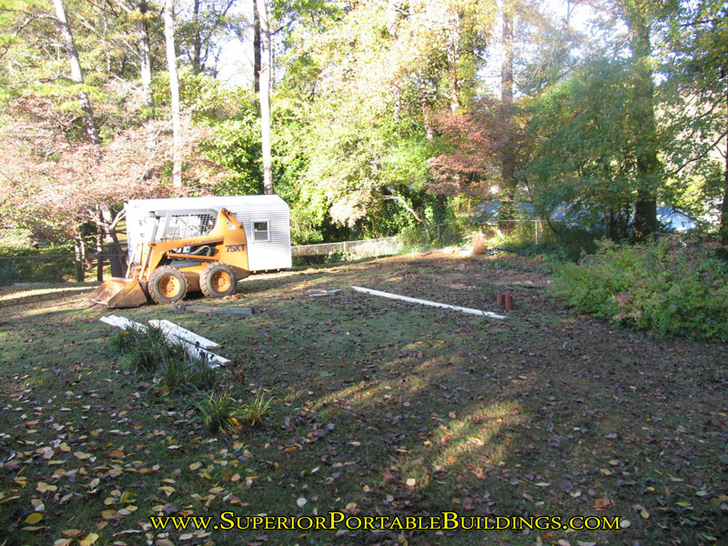 18 wide by 25 long concrete slab with gravel drive a