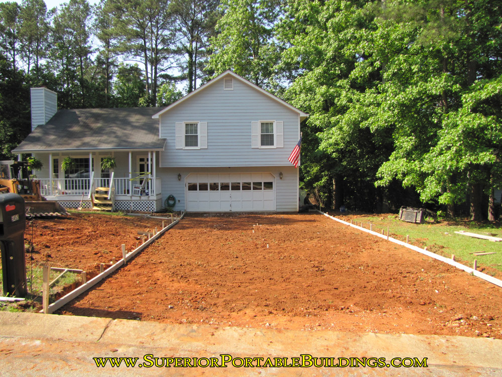 Broken concrete driveway removed.