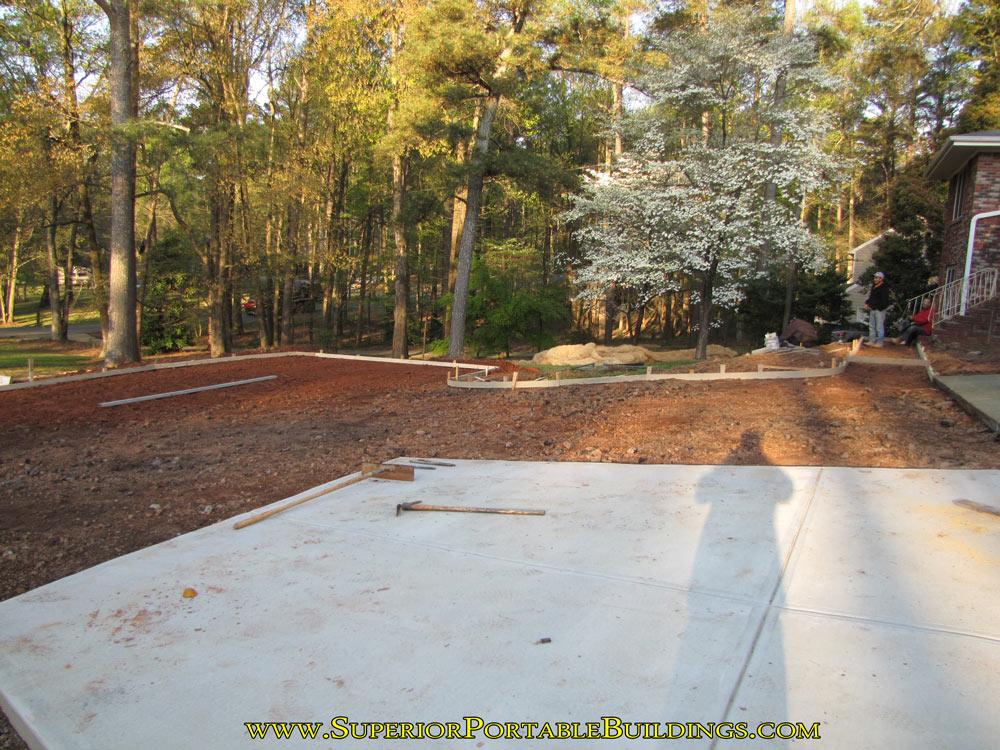Setting concrete forms for parking area.