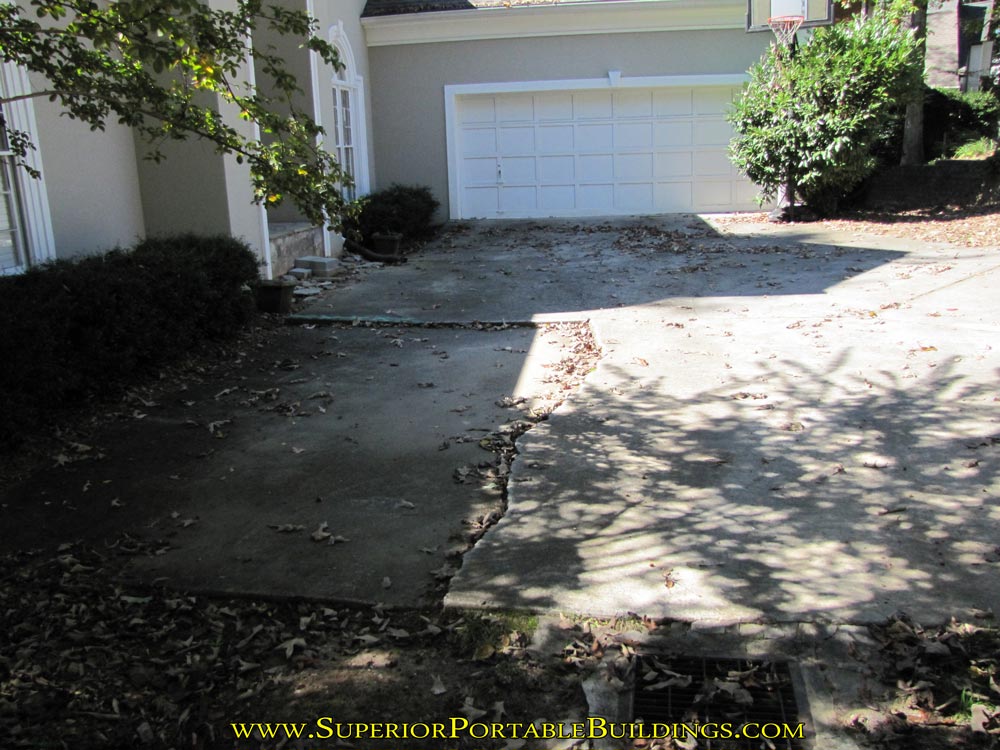 Concrete broken at front of house sending water into foundation