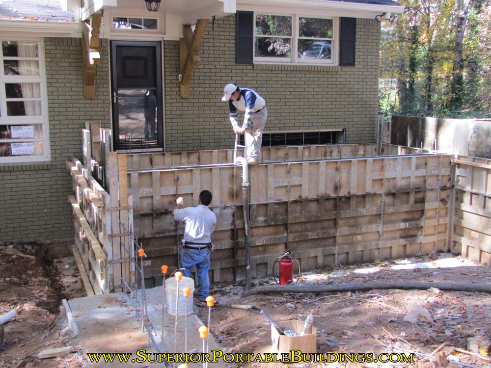 Putting the concrete in the walls.