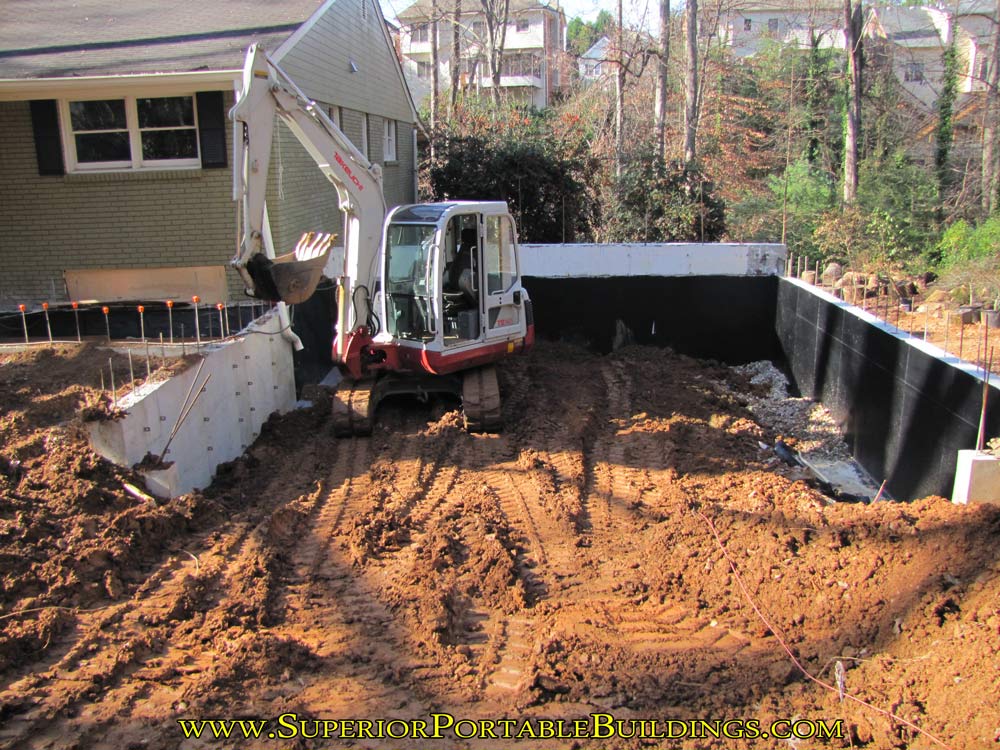 Putting in fill dirt for the garage slab.