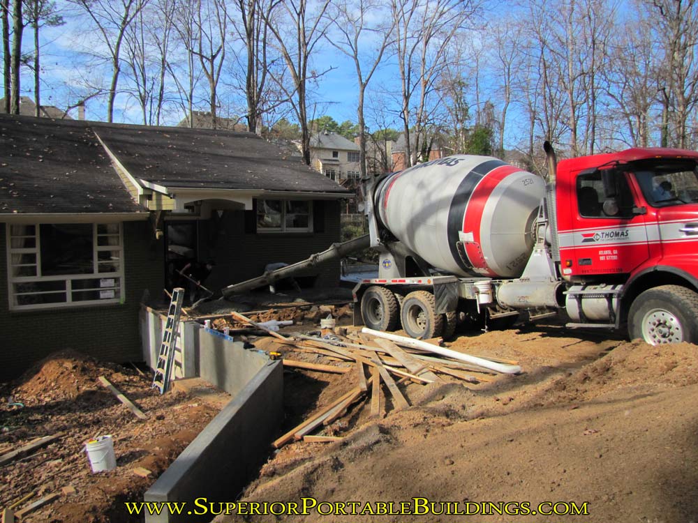 Pouring the concrete porch entrance and side walk.