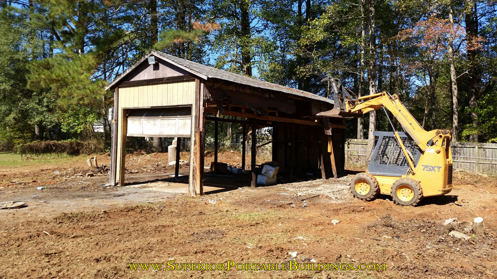 Tearing down the wood barn.