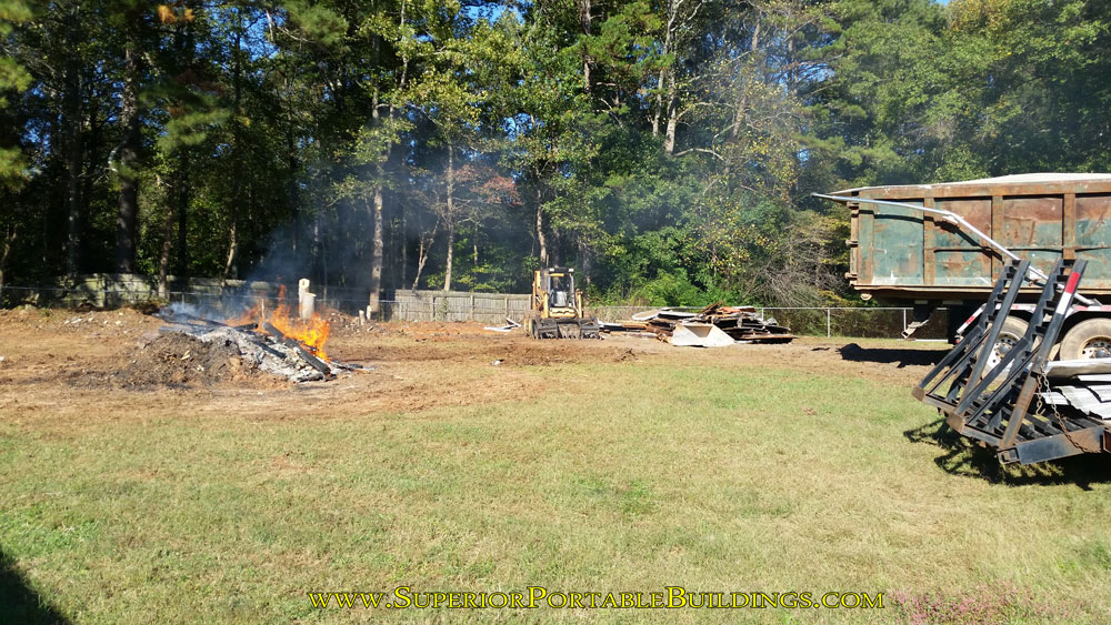 Finishing up the tear down of the wood barn.