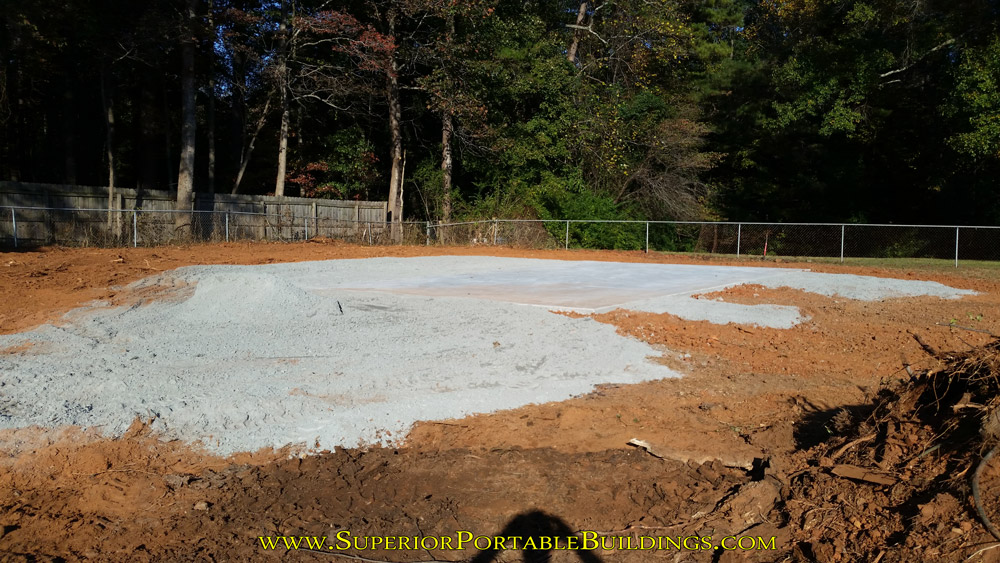 Concrete and gravel base for the lean too installed.