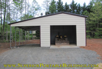 Steel garage with lean to.